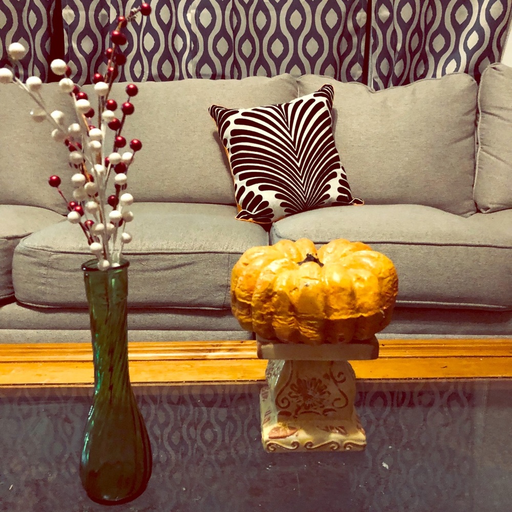 Orange/ black and white decorative pillow.